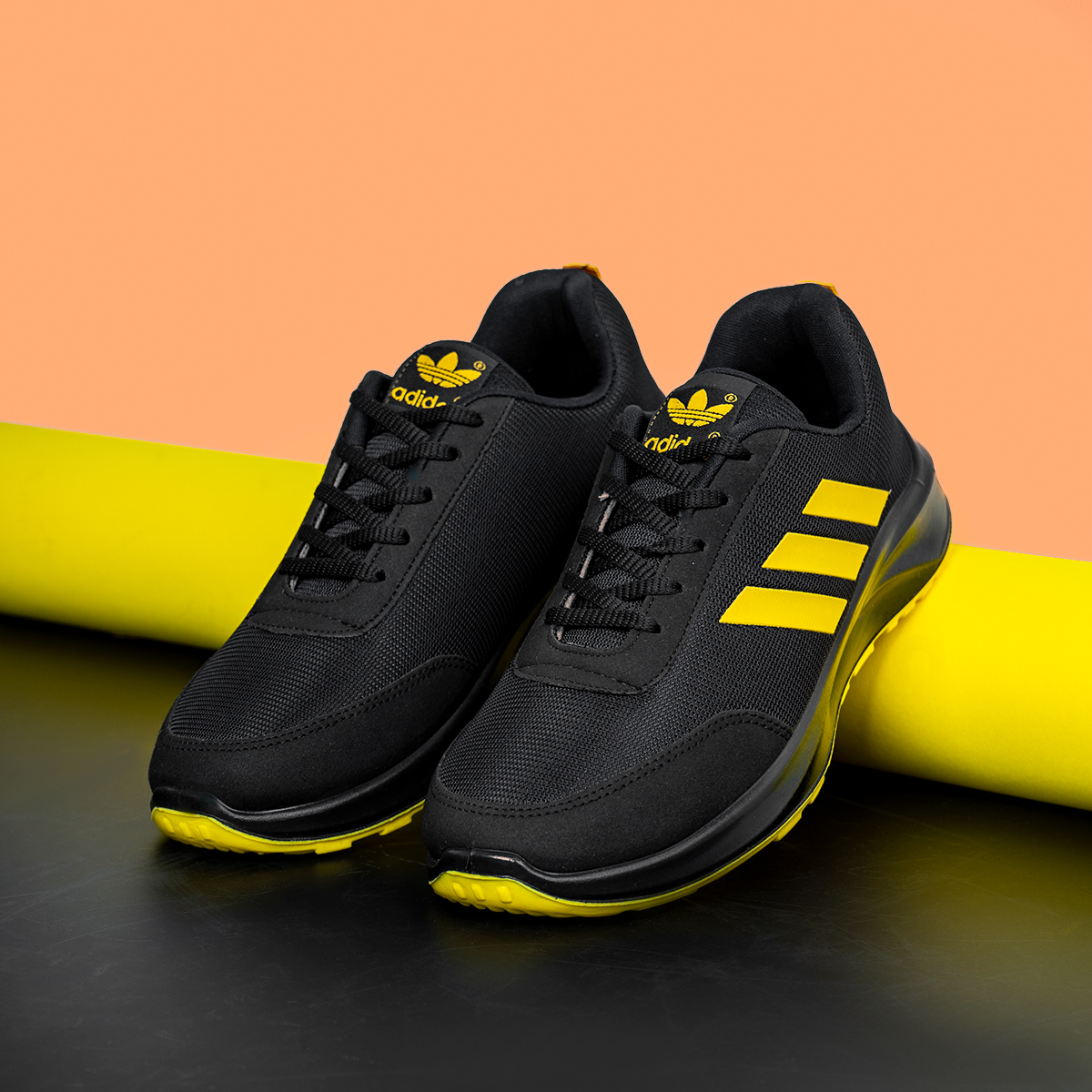 کفش ورزشی آدیداس مشکی زرد مردانه مدل Silva