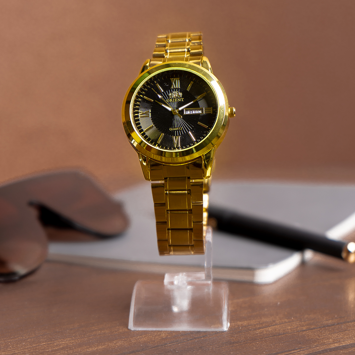 ساعت مچی Orient طلایی صفحه مشکی مدل Z20